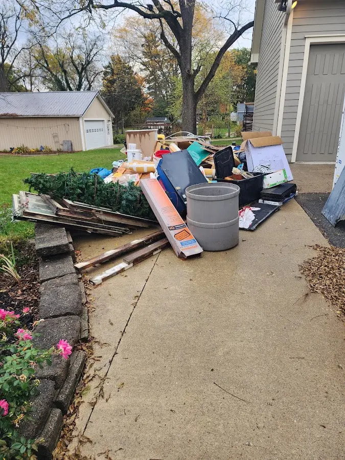 Dumpster being loaded with debris for Commercial Dumpster Rental in Chatham